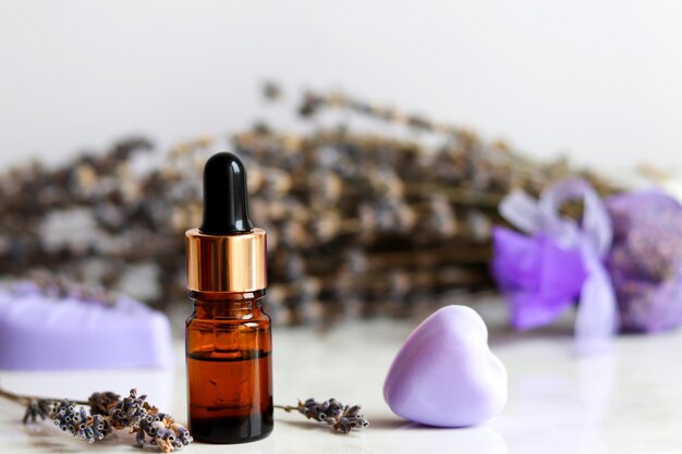 Set of lavender cosmetics Bottle of essential oil with dropper and lavender soap