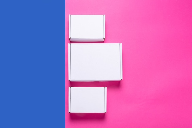 Photo set, lot of white cardboard box on color background, top view