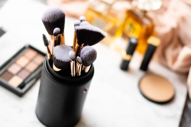 Set of luxurious black makeup brushes in leather case