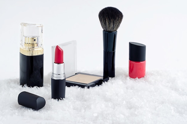 Set luxury cosmetics, red lipstick, nail polish, powder, brush, perfume