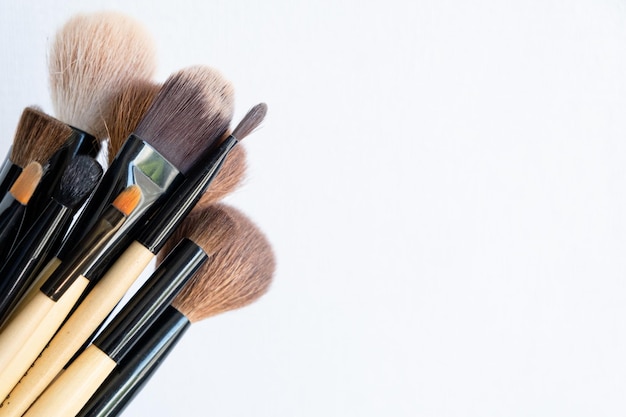 Set of makeup brushes on a light background Variable focus