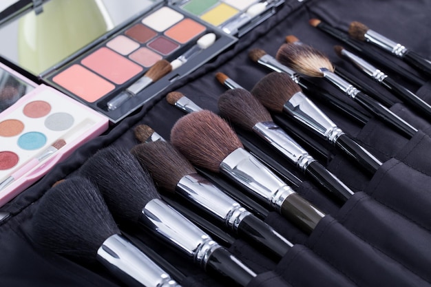 Set makeup brushes on the table.