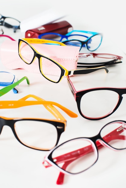 Set of many different colored glasses on white background