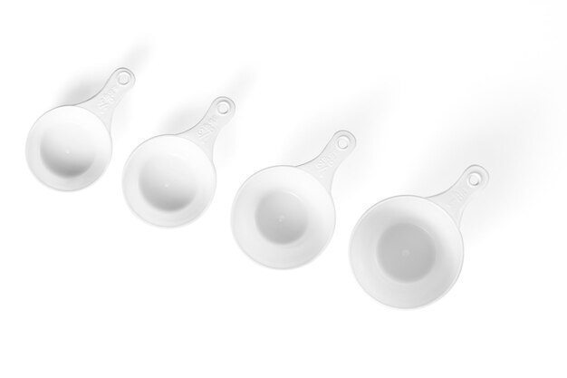 Set of measuring cups lined up white