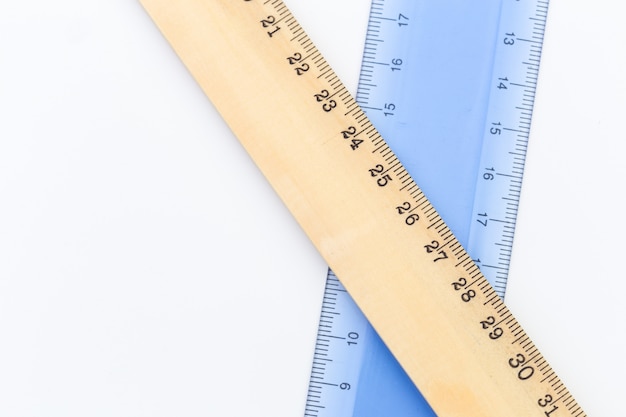 Set of measuring rulers on white surface