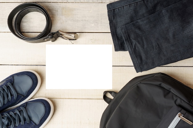 Photo set of mens clothing and accessories on a white wooden table