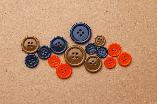 Photo set of multicolored buttons on beige