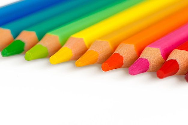 set of multicolored pencils on a white background closeup