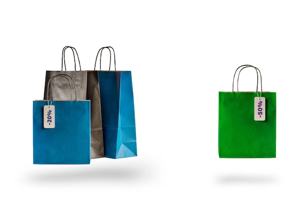 Set of multicolored shopping bags on a white isolated background sale and discounts      packages fl...