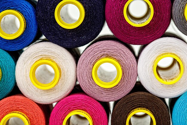 Set of multicolored spools of thread for sewing