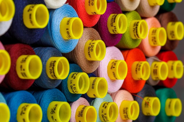 Set of multicolored spools of thread for sewing
