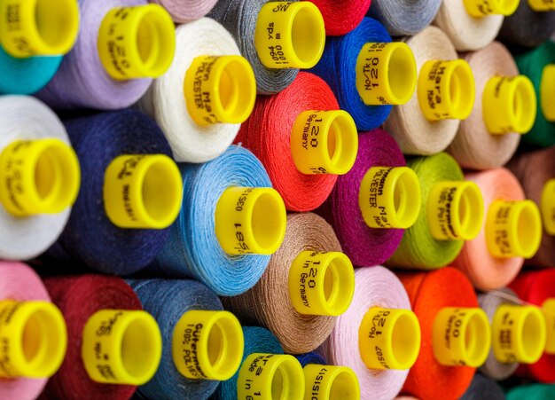 Set of multicolored spools of thread for sewing