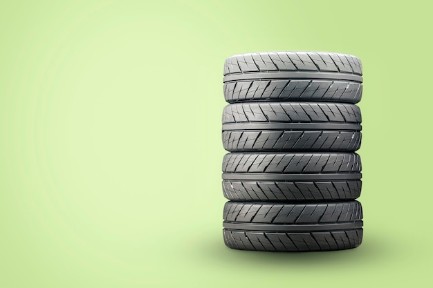 A set of new summer tires on a green surface