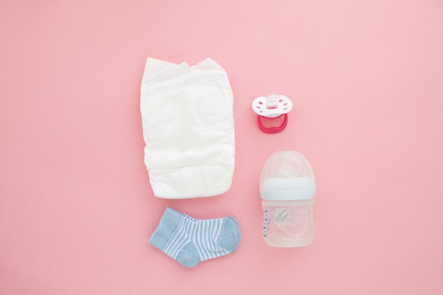 Photo set for a newborn nipple bottle diaper socks