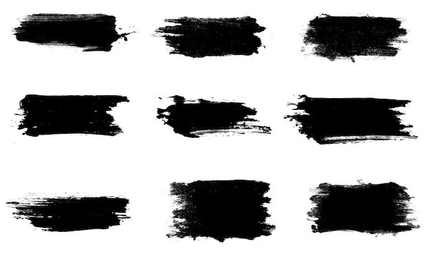 Photo set of nine black strokes of paint isolated on a white background. design brush