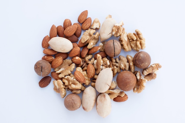 A set of nuts of different types lies on a light background