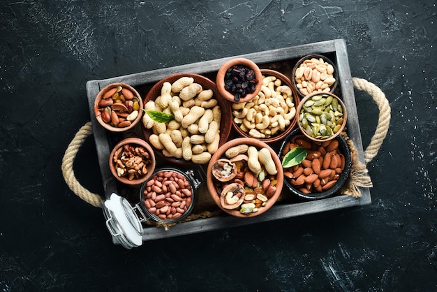 Set nuts and dried fruit in a wooden box. Top view. Free space for your text.