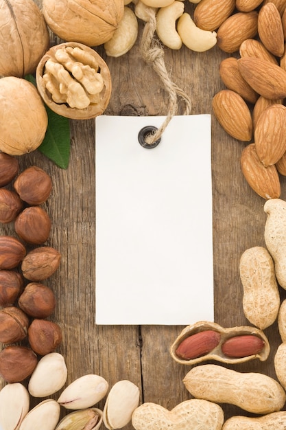 Set of nuts fruit and tag label on wood texture