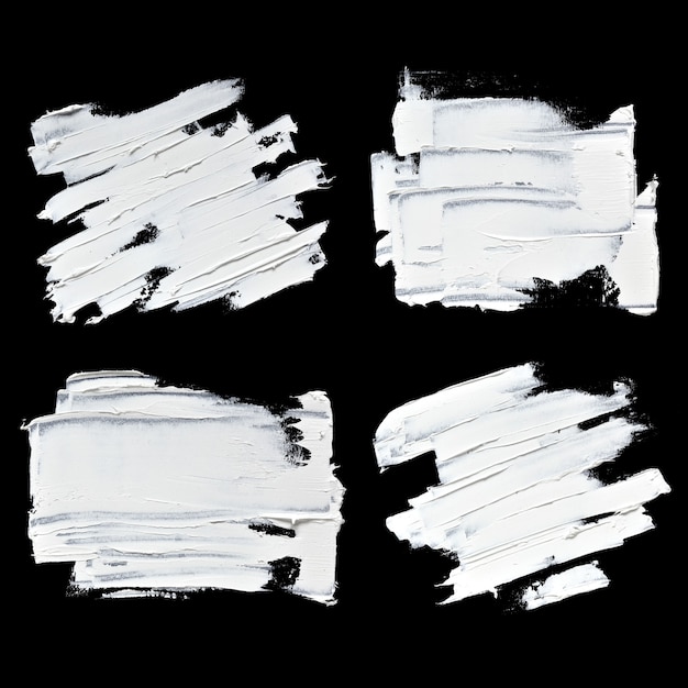 写真 黒の背景に分離された白い油絵の具テクスチャブラシストロークのセット