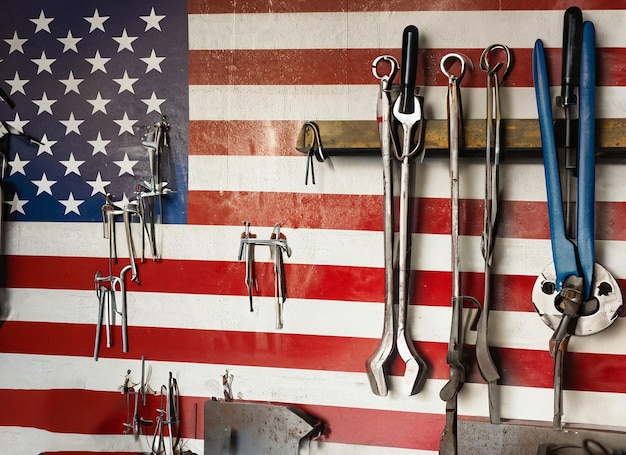 A set off a lot of different red tools for working include hammer USA flag background