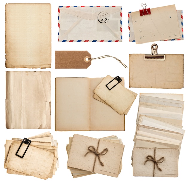 Photo set of old paper sheets, book, envelope, postcards, tags isolated on white background