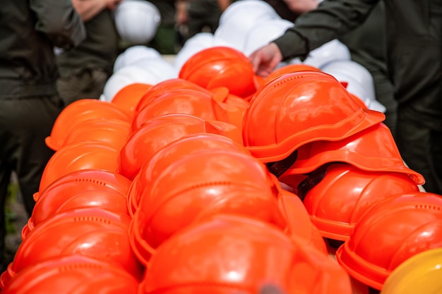 Set orange deferential helmet construction tools for industrial safety Set of protective hardhats Onstruction helmets Yellow safety helmets Orange safety helmets construction