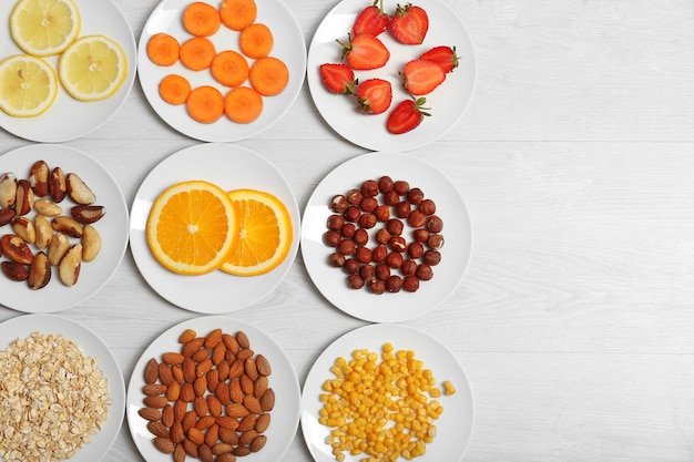 Set of orange products on wooden background