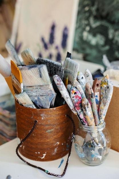 Photo set of paint brushes close up on the table