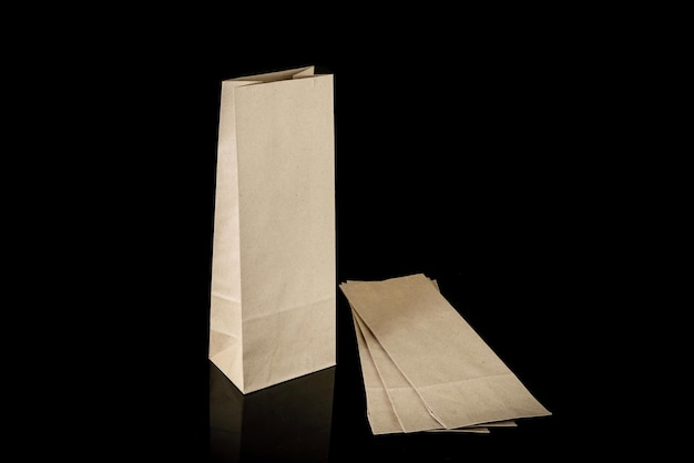 Set of paper bags for shopping on black background Mockup for design