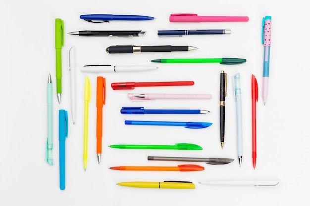 Photo set of pens on white surface