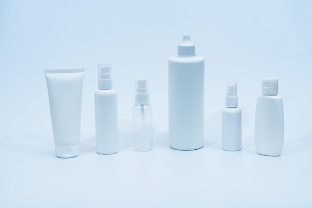 Set of plastic bottles containers for cosmetics on white
background