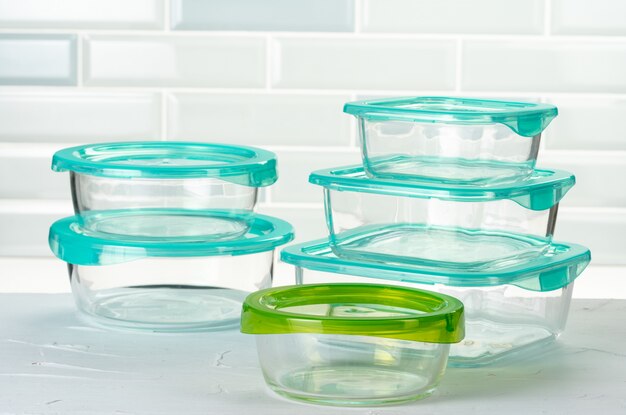 Set of plastic boxes kitchen ware on kitchen counter