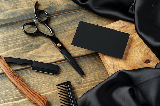 Photo set of professional barber tools on wooden table