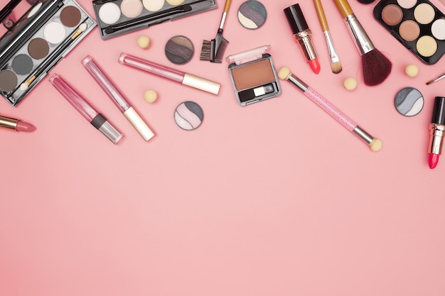 Set of professional cosmetics, makeup tools and accessories on pink background, beauty, fashion, shopping concept, flat lay. High quality photo