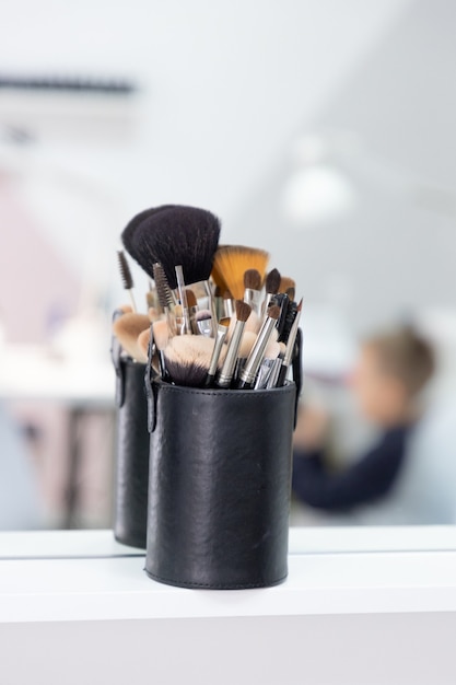 Set of professional make up brushes in black holder