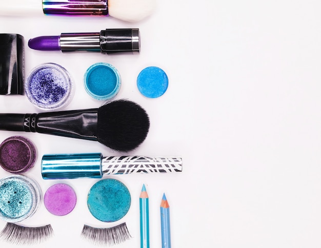 A set of professional multi-colored cosmetics for make-up on a white background