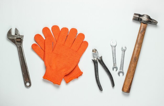 Set of professional work tools on a white background. Top view