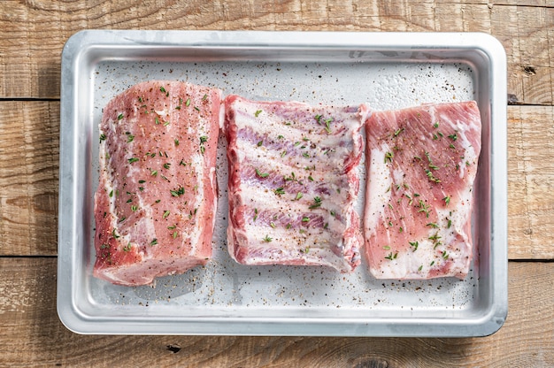 Photo set of raw pork cuts,  loin meat, spare ribs and brisket.