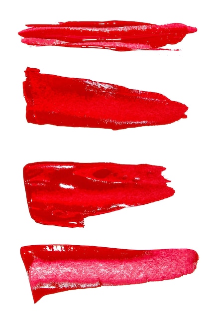 A set of red brushstrokes of various shapes on a white background