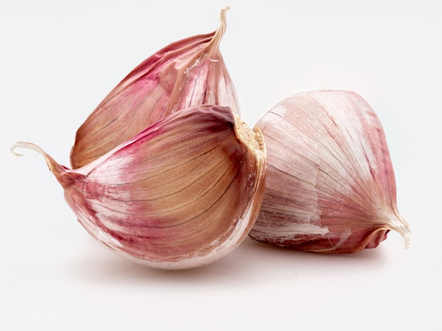 Set of red garlic cloves. Isolated on white