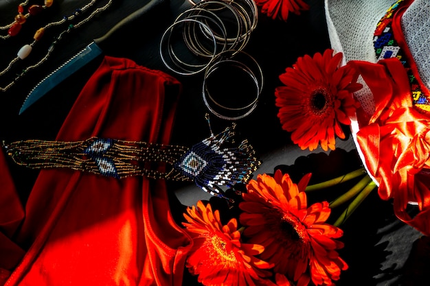 Set of red white and colorful fashion accessories on a black background