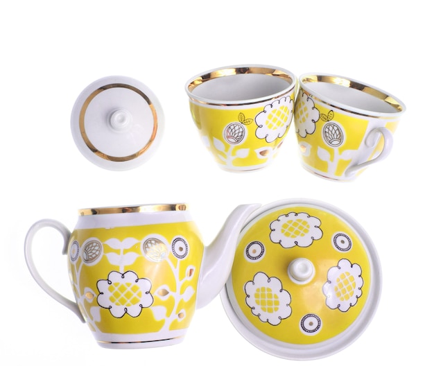 Set of retro ceramic cups with patterns, teapots, sugar bowl isolated