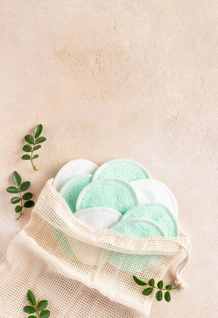 Set of reusable cotton makeup removing pads in mesh bag