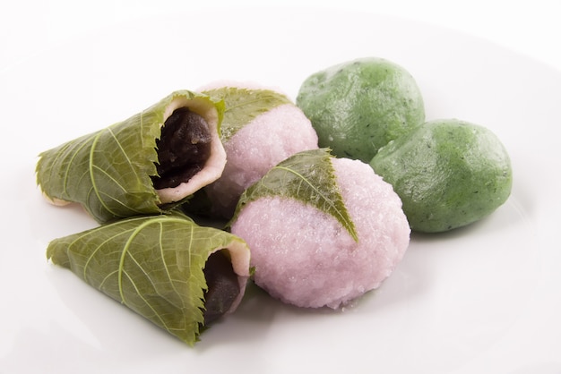 set of sakura mochi dessert for spring season sakura blossom made of rice cake with bean paste wrapp