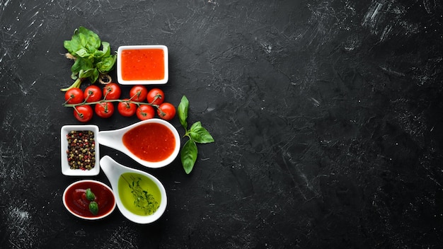 Photo set sauces and spices on a wooden background top view free space for your text