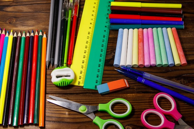 Set of school stationery supplies on wooden desk. Back to school concept