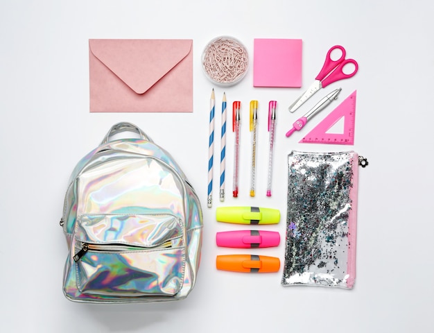 Set of school supplies with backpack isolated