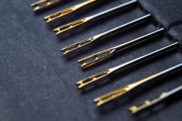 Set of sewing needles with carabiners, gold plated.