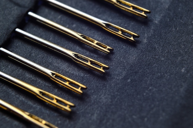 Set of sewing needles with carabiners, gold plated.