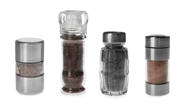 Photo set of shakers with black salt isolated on white
